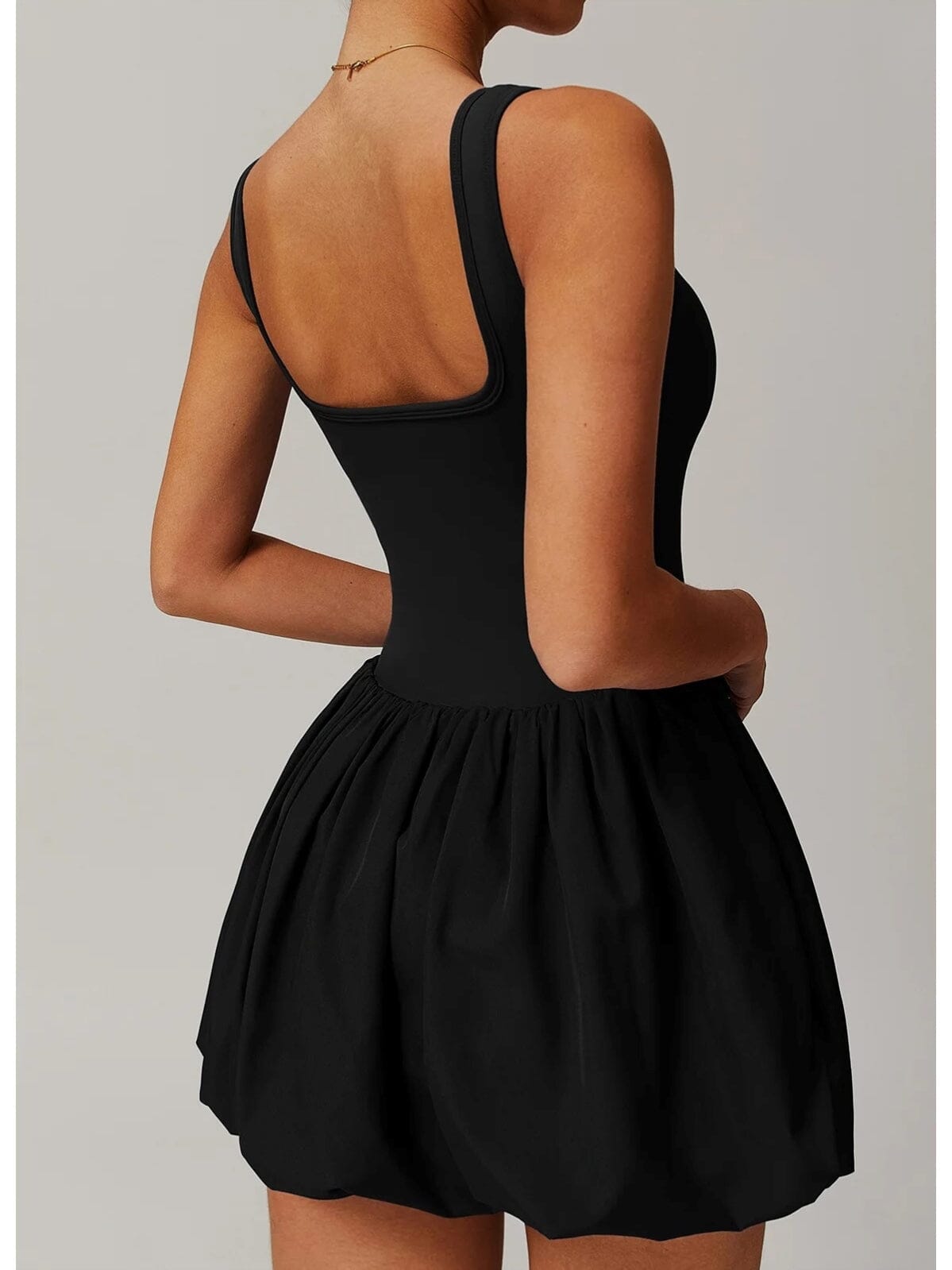 Combinaison Sport Femme Noire 2-en-1 : Élégance et Maintien pour Toutes Vos Activités